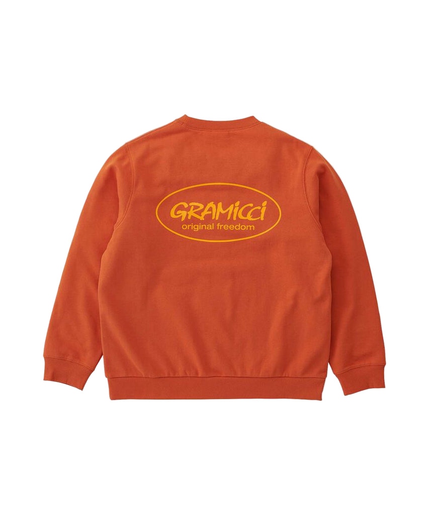 Orange sweatshirt with 'Gramicci' logo on the back against a white background